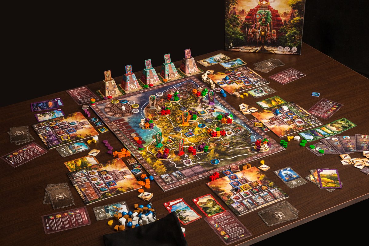Ahau board game in full play with all components spread on the table